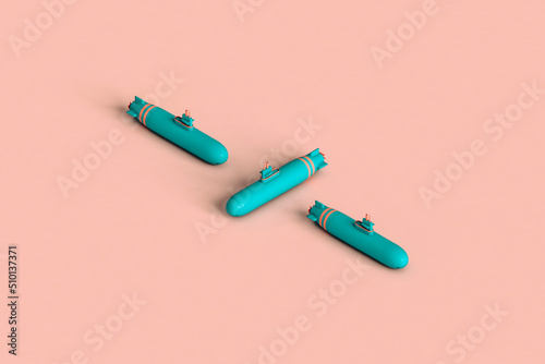 three blue submarines on pink background.with copy space. photo