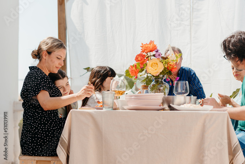 Family having lunch at terrace photo