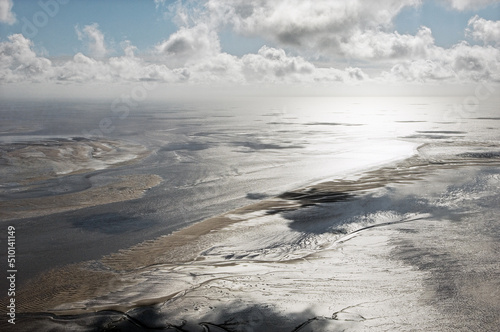 Morecambe Bay showing tidal mudflats northwest of Lancaster, Lancashire, England.  Looking southwest. Aerial.