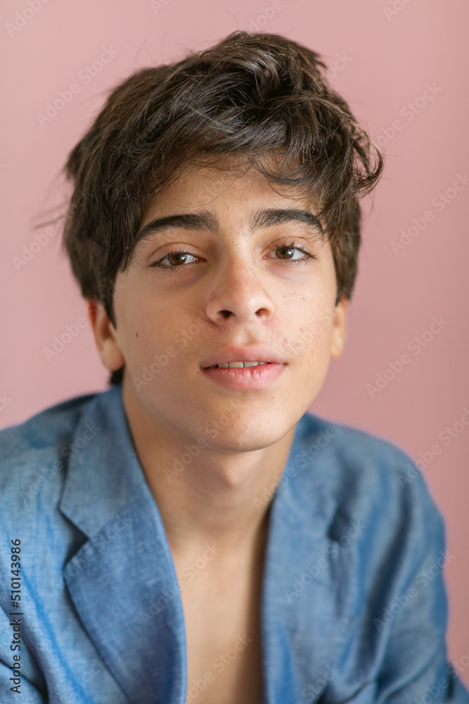 Teen boy wearing jacket and shirtless portait Teen boy wearing jacket and shirtless portait