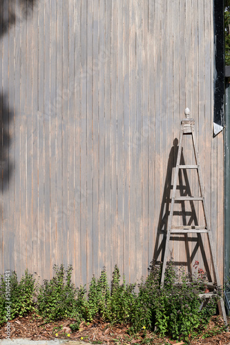 Timber trestle against large barn style property photo