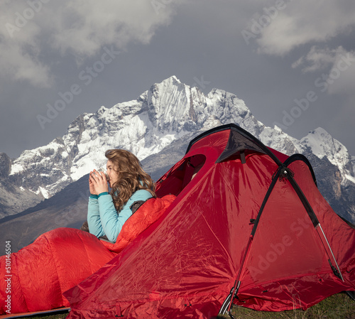 Beautiful woman drinking coffee outdoors  photo