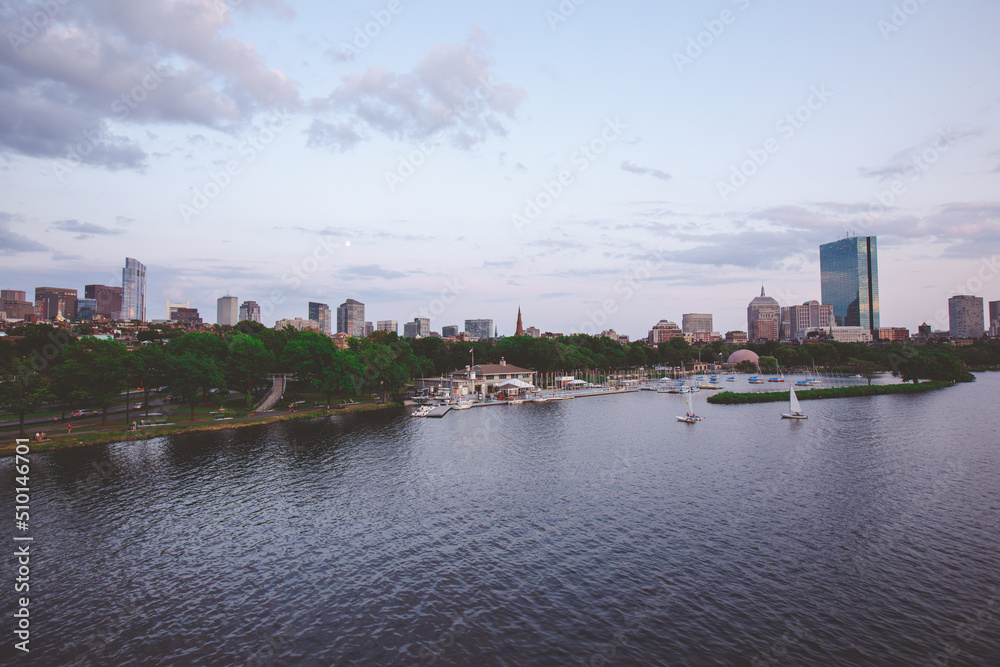 The Charles River Esplanade with sailing boat and urban building city skyline.