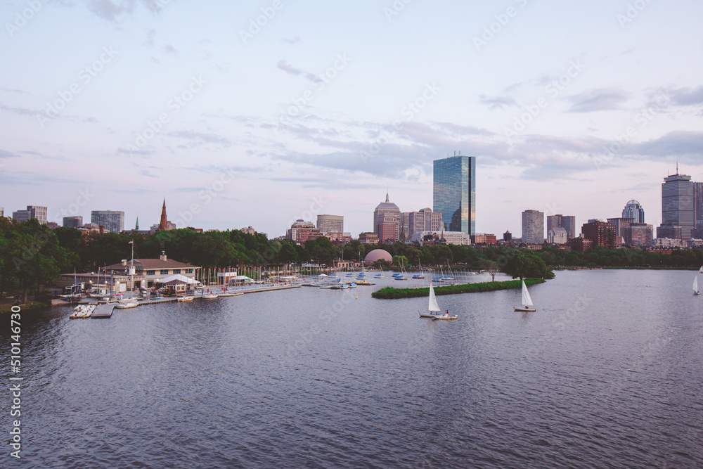 The Charles River Esplanade with sailing boat and urban building city skyline.