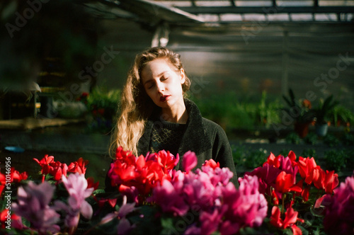 A blond woman in pink flowers
