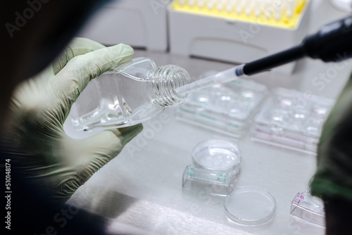 Crop biologist filling glass photo