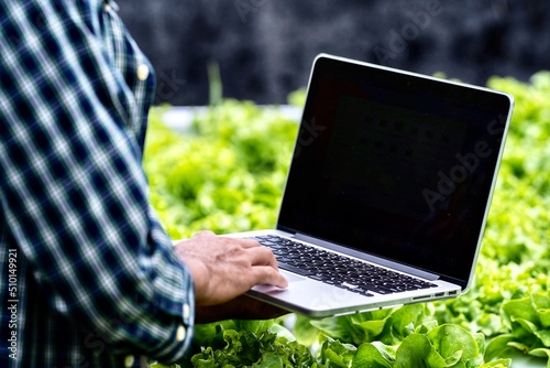 
Farmers are analyzing information through labtop to make farming decisions.