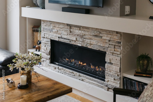 Gas fireplace detail and stone work. photo