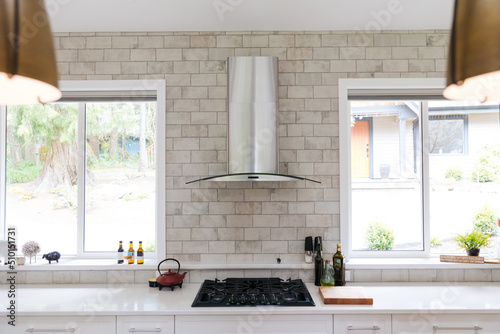 Counter, hood fan and stove.