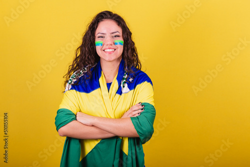 Woman soccer fan, fan of brazil, world cup, arms crossed, smiling, confident