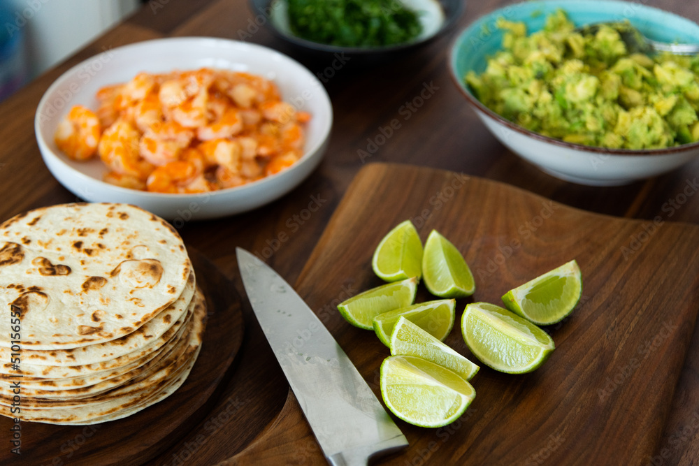 Preparing shrimp tacos: shrimp taco ingredients on kitchen counter