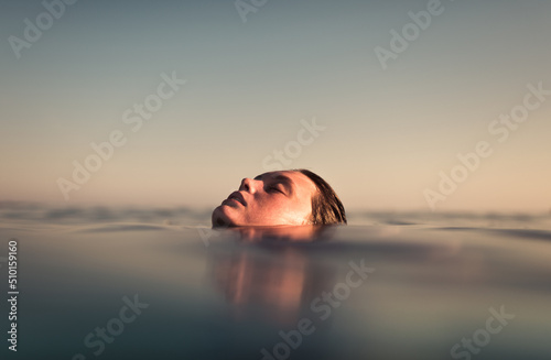 Asleep woman dreaming on the sea photo