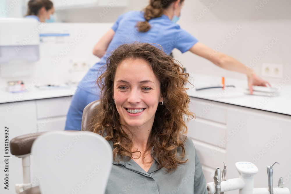 Patient With Ceramic Braces Looking The Mirror Patient With Ceramic Braces Looking The Mirror