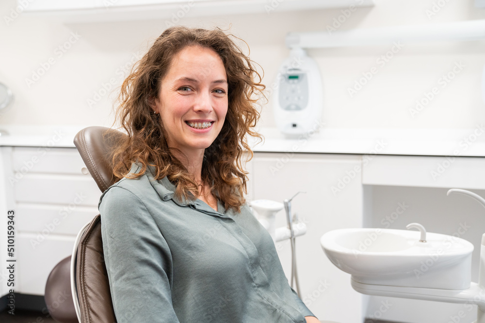 Woman With Clear Braces In Dental Clinic Woman With Clear Braces In Dental Clinic