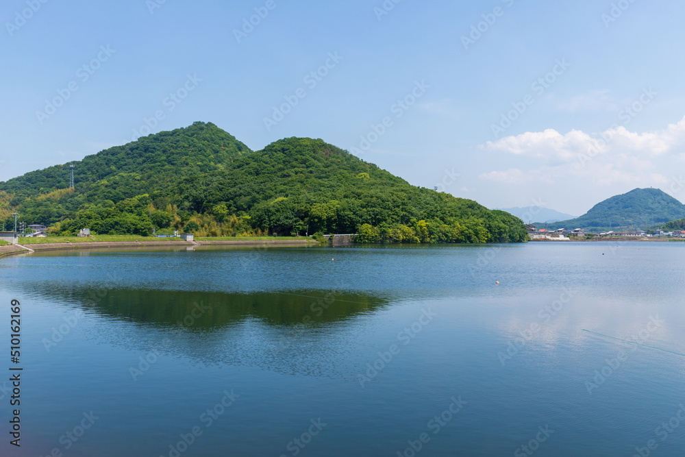 Mountains and farm reservoir in takamatsu city , kagawa, shikoku, japan