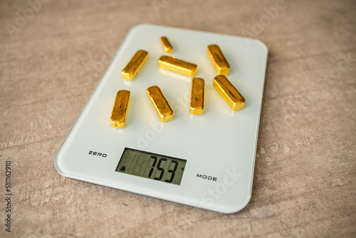 Gold Bars On Scales photo