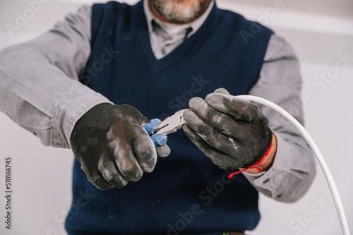 Crop male electrician crimping wire