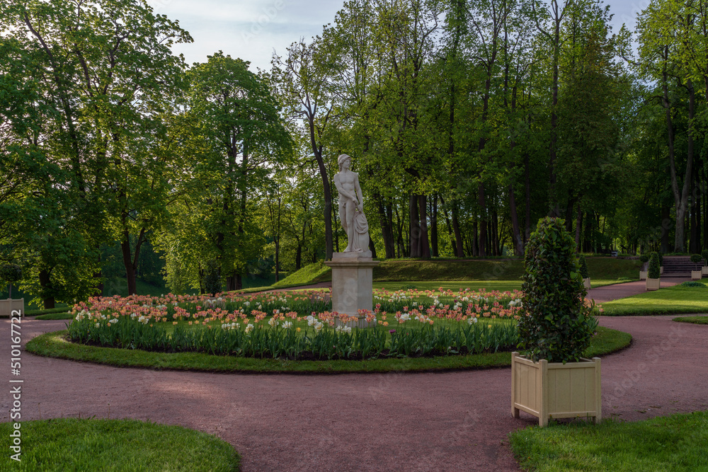 Gatchina, St. Petersburg, Russia, 06.05.2022: Statue of Young Mars in the Lower Dutch Garden of Gatchina Park on an summer sunny morning