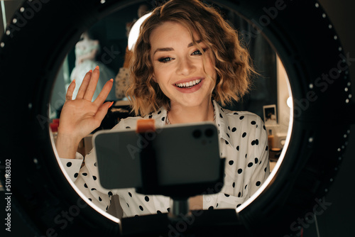 Video blogger saying hello while recording video