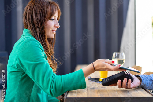 Woman paying for order in restaurant