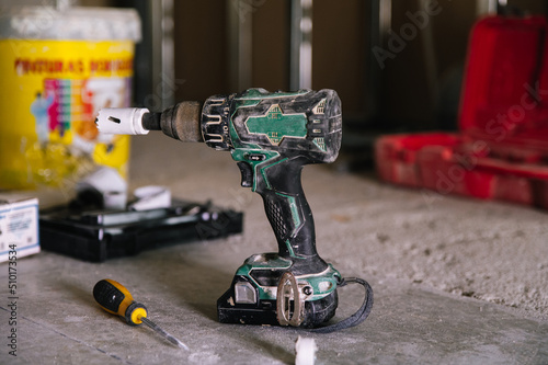 Cordless drill on floor during renovation