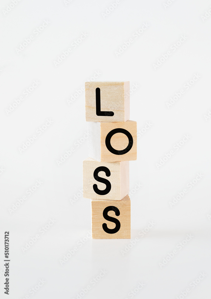 Cubic wooden blocks forming the 'loss' text Cubic wooden blocks forming the 'loss' text