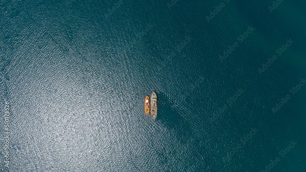 drone overhead of two tugboats parked together drone overhead of two tugboats parked together