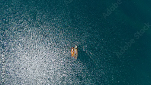 drone overhead of two tugboats parked together