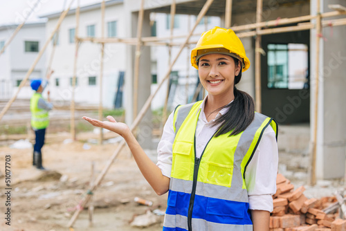 happy woman engineer worker builder girl lady smile present promote gesture at construction site.