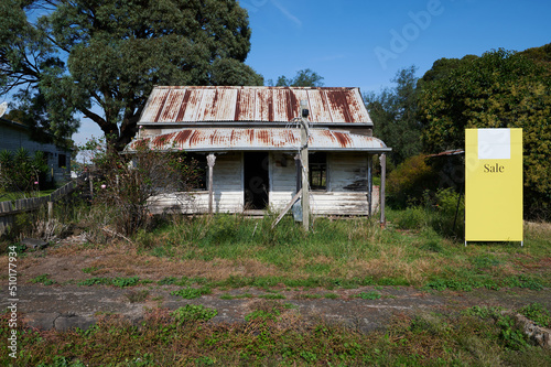 Old ransacked home for sale photo