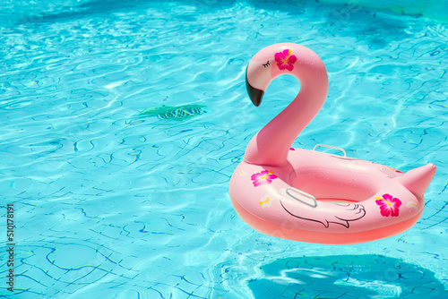 Empty Swimming Pool with Pink Flamingo Swimming Ring Cooling chill Summer season nobody. © Quality Stock Arts