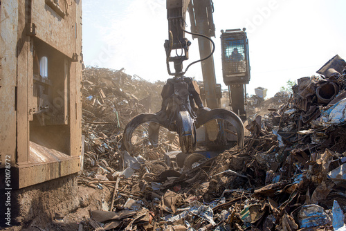 scrap metal grab on a bright sunny day