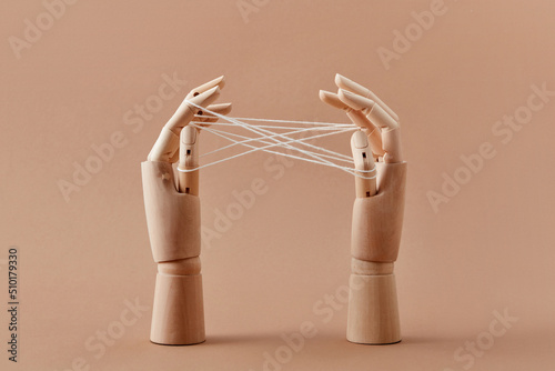 Mannequin's hands are playing a Cat's cradle game.