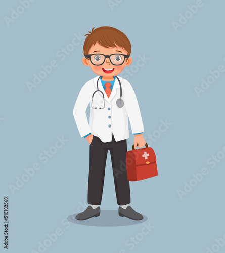 cute little boy with stethoscope wears doctor uniform holding medical bag. Job and occupation concept for educational purpose