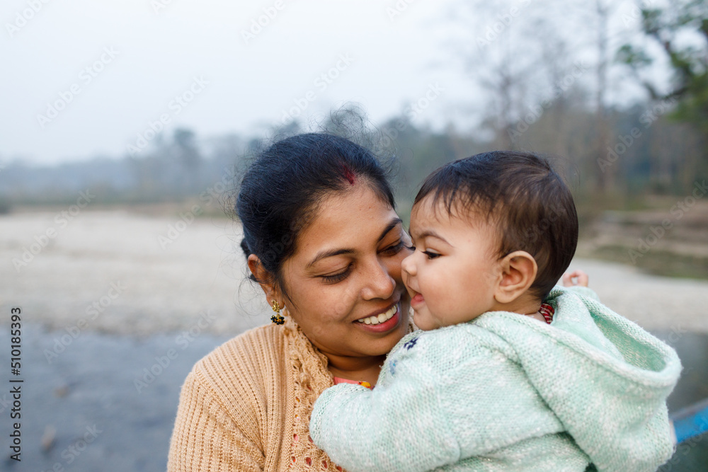 Mother sharing cheerful moment with her baby girl Mother sharing cheerful moment with her baby girl