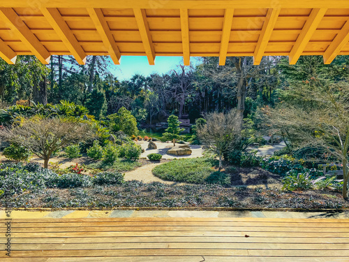 Εκτύπωση καμβά serene view from the inside of a wooden dojo looking out at a lush japanese gard