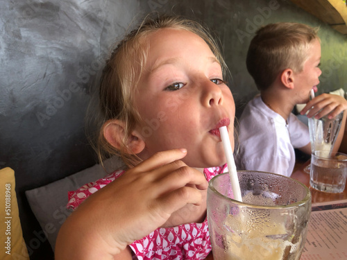 user-generated content child drinking from straw  photo