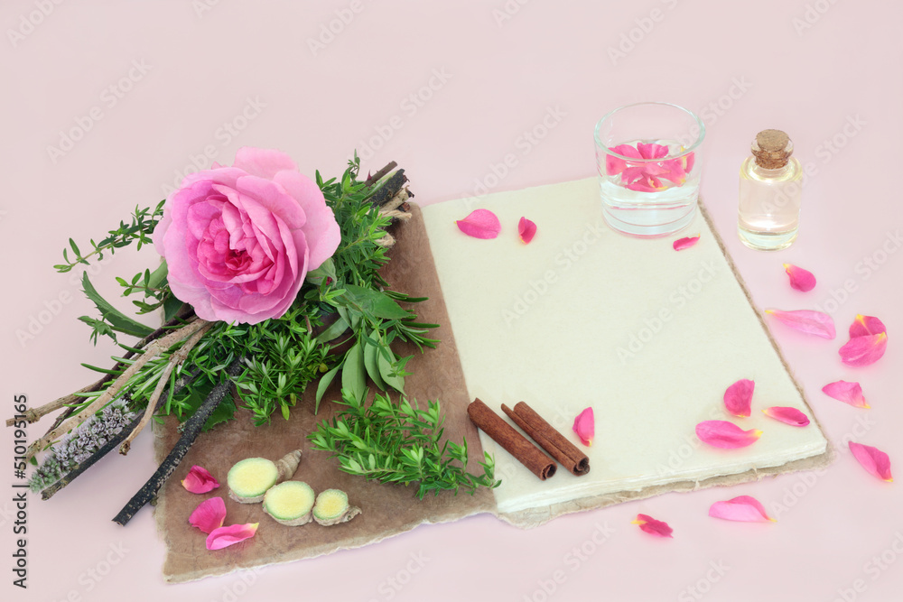 Witches love potion recipe spell with rose flower, herb bundle, quartz crystal, spring water, hemp recipe notebook, oil bottle, ginger and cinnamon spice. Magical romantic concept on pink. Witches love potion recipe spell with rose flower, herb bundle, quartz crystal, spring water, hemp recipe notebook, oil bottle, ginger and cinnamon spice. Magical romantic concept on pink.