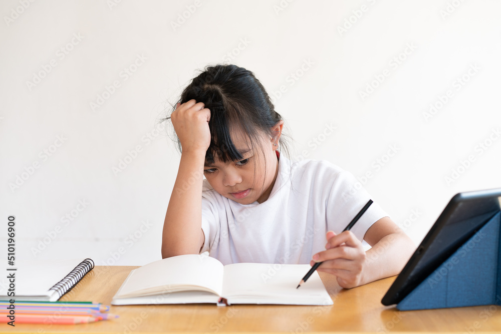 girl serious with learning online during coronavirus . girl serious with learning online during coronavirus .
