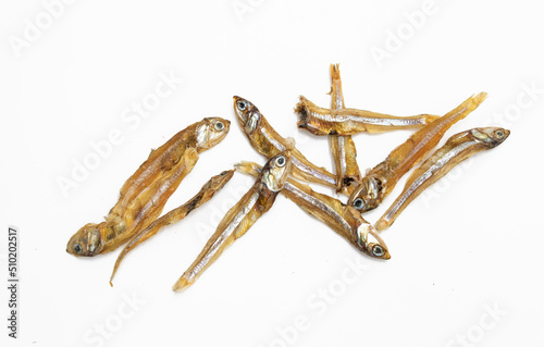 small sun dried fishes .Tiny Fish as food ingredient, rich natural source of calcium nutrition over on white background.