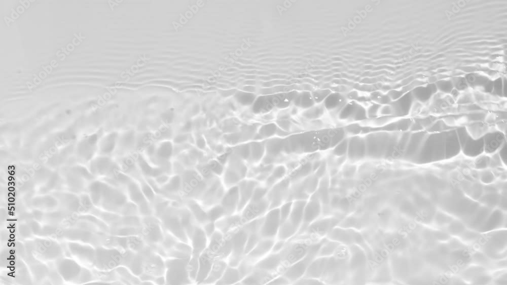Close up view on Water texture with waves and light reflections. Water overlay effect for video mockup. Organic light gray drop shadow caustic effect with wave refraction of light. Slow motion full HD