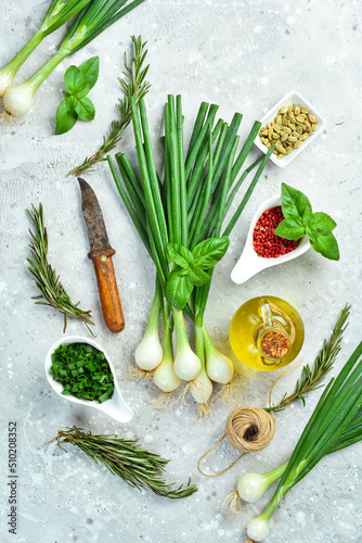 green onions on a stone background. Organic food food. Top view.