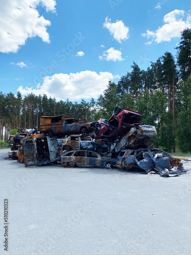 Machine graveyard. Dump of shot civilian cars by Russian invaders in Ukraine.