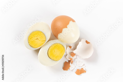 Fresh hard boiled chicken eggs isolated on white, top view photo