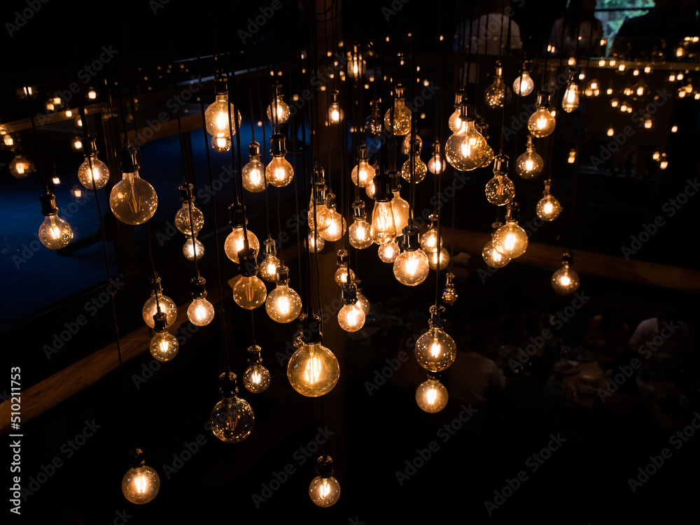 A lamp with old incandescent lamps in a dark room for modern interior decoration