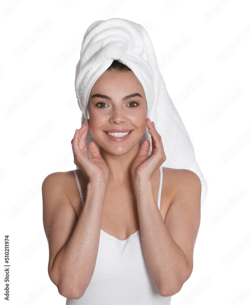Beautiful young woman with towel on head against white background