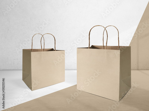 Blank brown kraft paper shopping bag isolated on white background