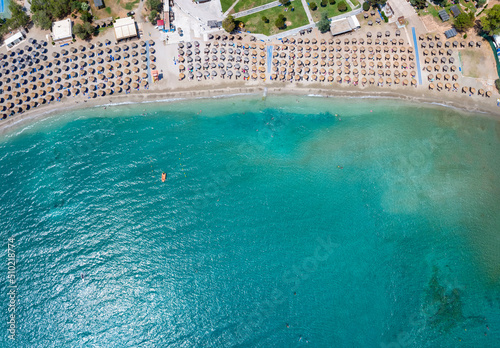 Fototapeta Naklejka Na Ścianę i Meble -  Aerial top view of the beautiful beach at Vouliagmeni, south Athens Riviera coast, Greece, with turquoise sea