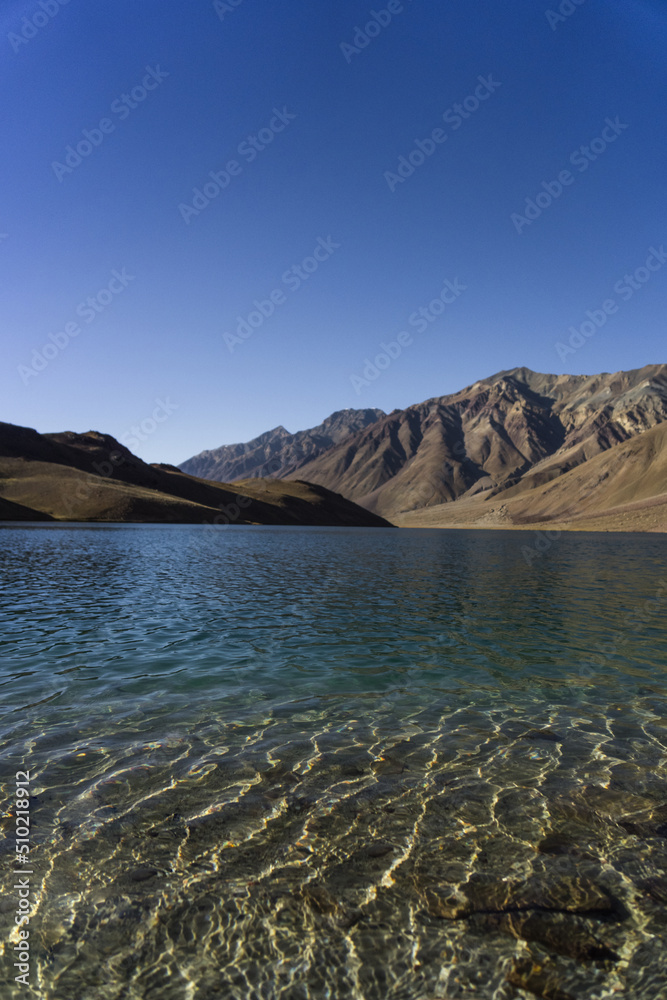 Beautiful Chandra Taal lake in Spiti valley, Himachal Pradesh. Tso Chigma or Chandra Tal is a lake in part of the Lahul and Spiti district. Chandra Tal lake also known as Lake Of The Moon