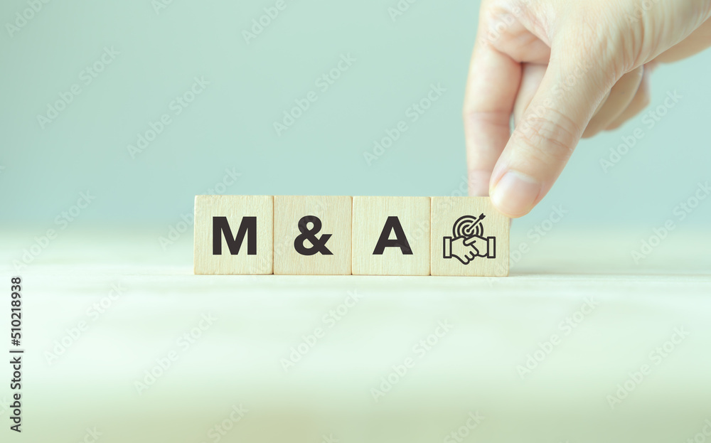 Business mergers and acquisitions concept. Share acquisition, asset business acquisition, amalgamation. Business review and development model. The abbreviation M and A on smart background, copy space. Business mergers and acquisitions concept. Share acquisition, asset business acquisition, amalgamation. Business review and development model. The abbreviation M and A on smart background, copy space.